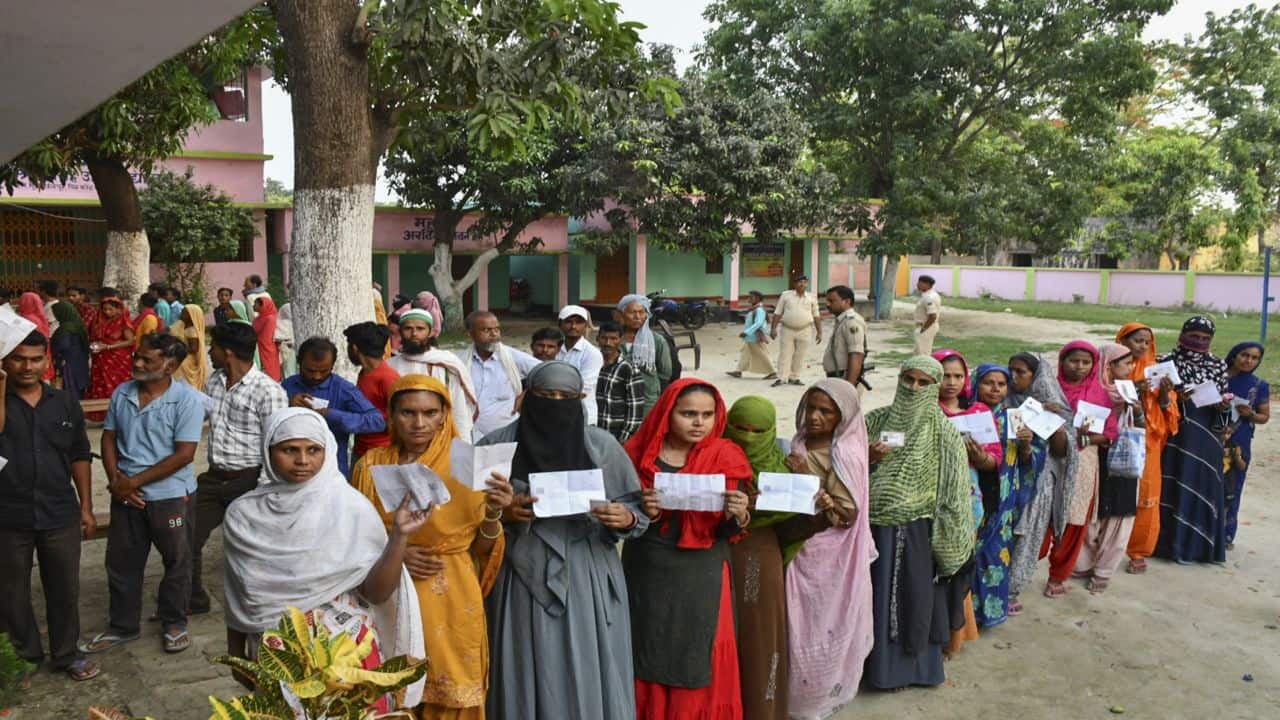 Muzaffarpur: People wait in queues to cast their votes during the 5th phase of Lok Sabha elections, at Mushahari in Muzaffarpur district, Monday, May 20, 2024. (PTI Photo)(PTI05_20_2024_000037B)