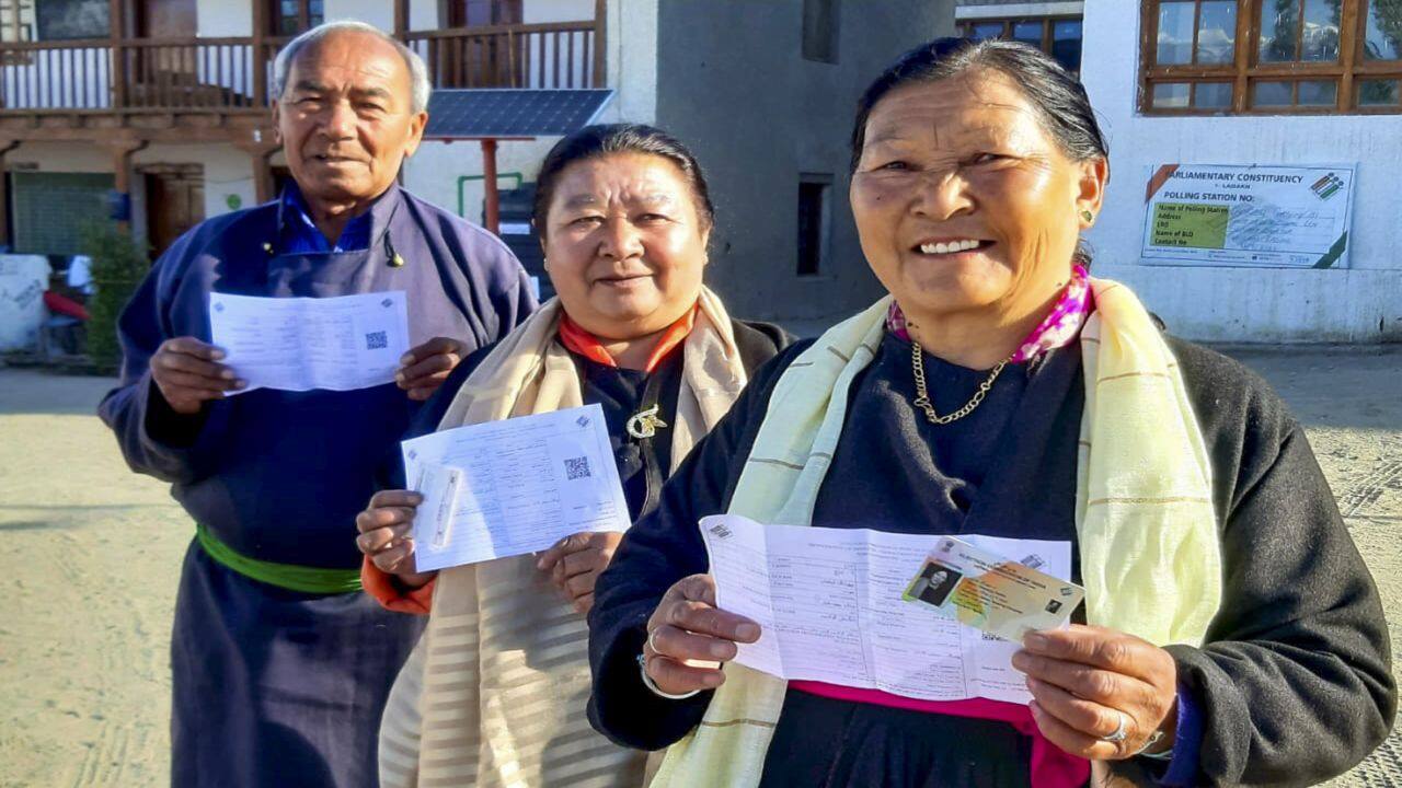 **EDS: IMAGE VIA @CEOofficeLadakh** Ladakh: People show their identification cards as they wait to cast their votes during the fifth phase of Lok Sabha elections, in Ladakh, Monday, May 20, 2024. (PTI Photo)(PTI05_20_2024_000047B)