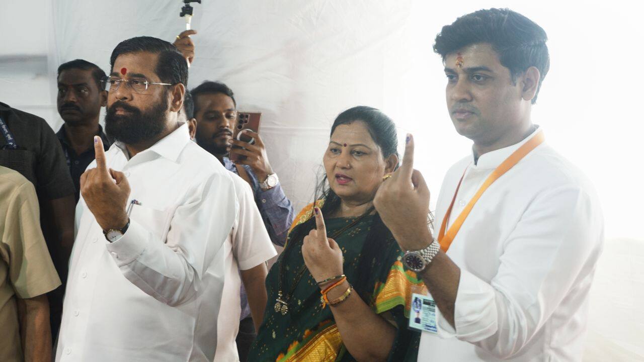 Thane: Maharashtra Chief Minister Eknath Shinde and his family members show their fingers marked with indelible ink after casting their votes for the fifth phase of Lok Sabha elections, in Thane, Monday, May 20, 2024. (PTI Photo)(PTI05_20_2024_000160B)