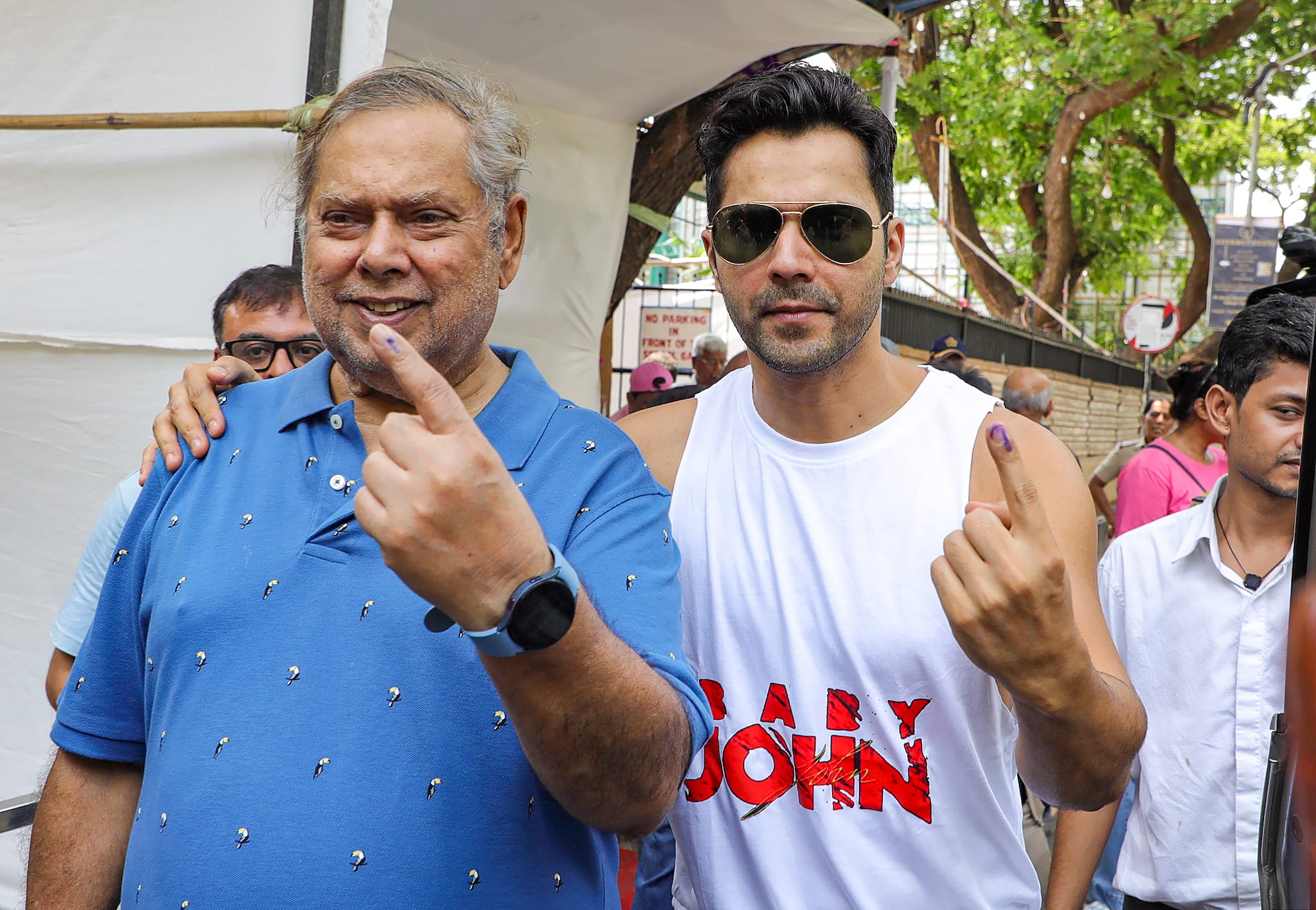 Mumbai: Bollywood actor Varun Dhawan and film director David Dhawan show their inked fingers after casting their votes during the fifth phase of Lok Sabha elections, in Mumbai, Monday, May 20, 2024. (PTI Photo)(