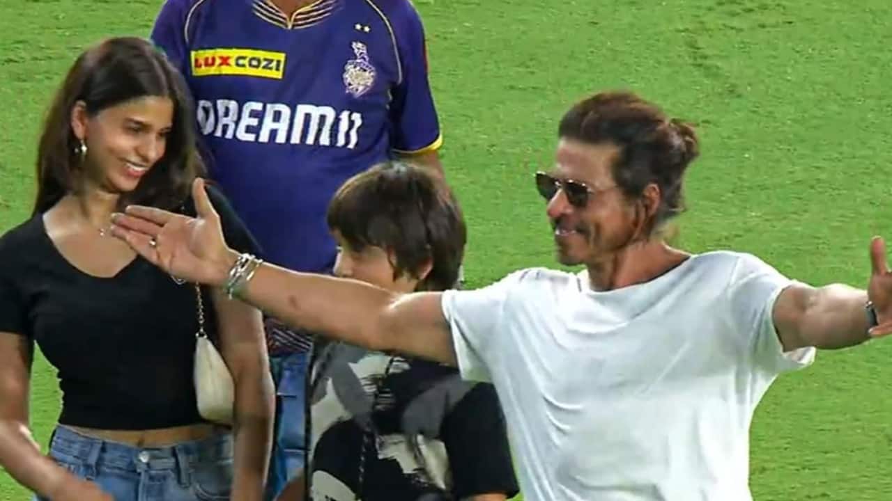 Suhana Khan and AbRam smile as their father and superstar Shah Rukh Khan does his signature open arm pose for fans after KKR's victory in IPL 2024