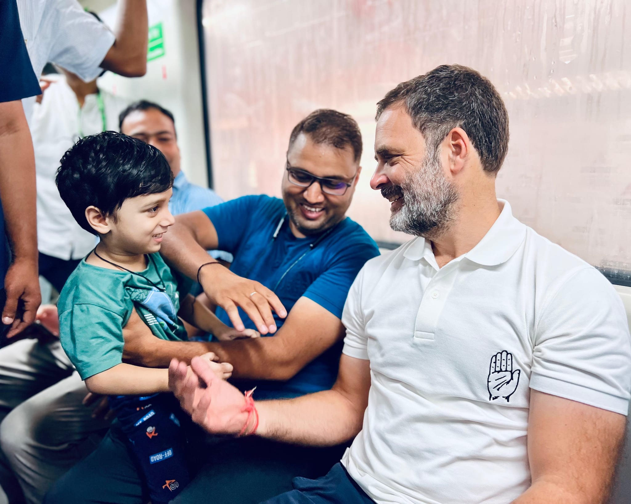 Rahul Gandhi having a fun time with a small kid in the Delhi Metro.