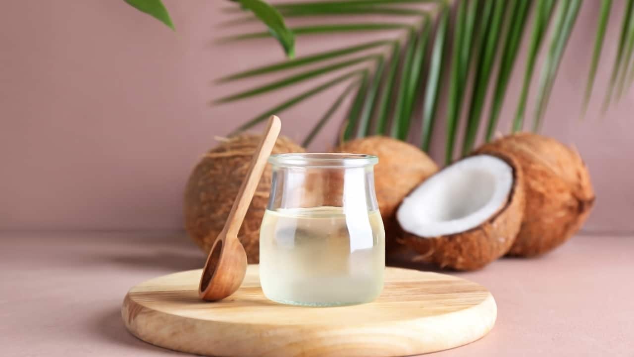 Coconut Oil: Massage coconut oil onto the scars regularly. Coconut oil contains vitamin E and fatty acids that promote healing and moisturize the skin (Image: Canva)