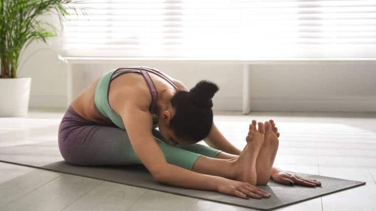 Best yoga poses for seniors: Paschimottanasana (Seated forward bend) (Image: Canva)