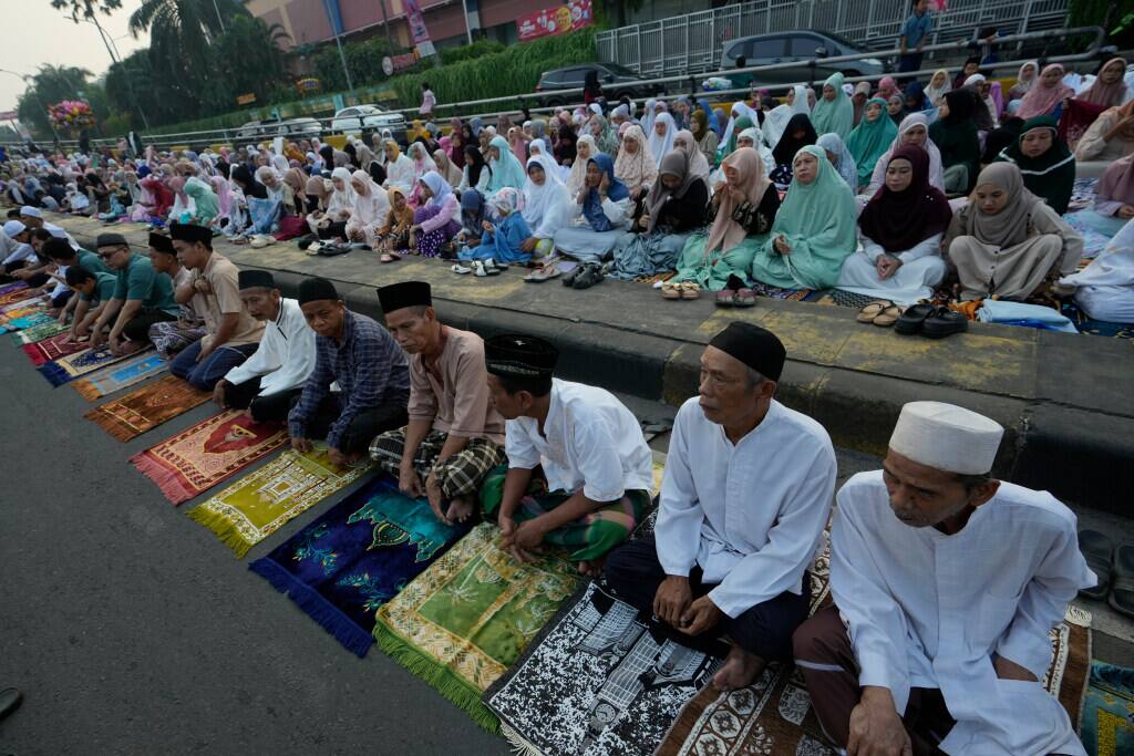 Muslims attend Eid al-Adha prayer on a street in Jakarta, Indonesia, Monday, June 17, 2024. Muslims around the world celebrate Eid al-Adha by sacrificing animals to commemorate the prophet Ibrahim’s faith in being willing to sacrifice his son. (AP Photo)