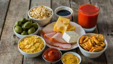 High-Sodium Foods: Excessive salt can affect your neurological system and increase stress hormone production. High sodium intake is linked to increased blood pressure and can lead to dehydration, both of which can exacerbate feelings of anxiety and stress. (Image: Canva) High-Sodium Foods: Excessive salt can affect your neurological system and increase stress hormone production. High sodium intake is linked to increased blood pressure and can lead to dehydration, both of which can exacerbate feelings of anxiety and stress. (Image: Canva)