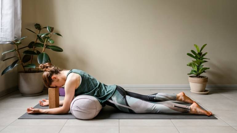 Sphinx Pose (Salamba Bhujangasana): Sphinx Pose stretches the chest, shoulders, and abdomen, helping to relieve stress and improve posture. Lie on your belly with your elbows under your shoulders and forearms flat on the floor. Lift your chest and head, keeping your lower body grounded. Hold for several breaths, then release (Image: Canva)