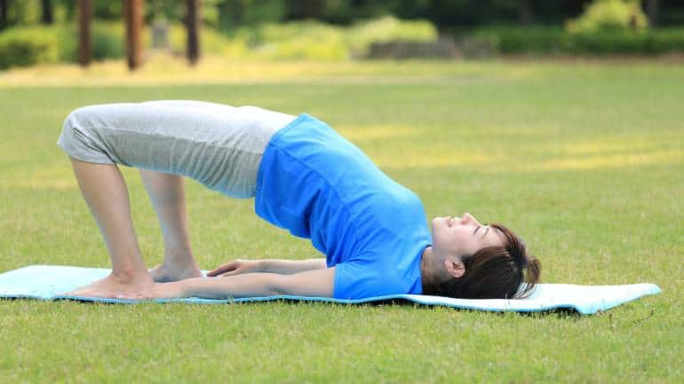 Bridge pose (Setu bandhasana): Lying on your back with your knees bent and feet flat on the floor, lift your hips towards the ceiling. Bridge Pose opens the chest and heart, encouraging deep breathing and helping to relieve tension in the back and neck. It’s particularly effective in reducing symptoms of mild depression (Image: Canva)
