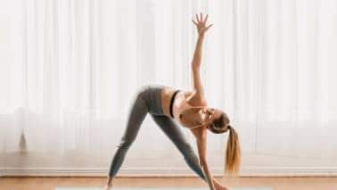 Best yoga asanas Trikonasana triangle pose. (Image: Canva)