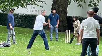 The captured image shows Shah Rukh Khan, who was fielding, keenly observing Suhana Khan who is waiting for the bowler with a bat in her hand.