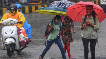 Commuters on a road during rain, in Mumbai, Saturday, June 29, 2024. (PTI Photo)(