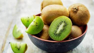 Kiwi: Kiwi contains serotonin and antioxidants that promote relaxation and reduce inflammation, enhancing sleep quality. It's a natural aid for calming the body and mind before bedtime, potentially improving overall sleep duration and quality. (Image: Canva)