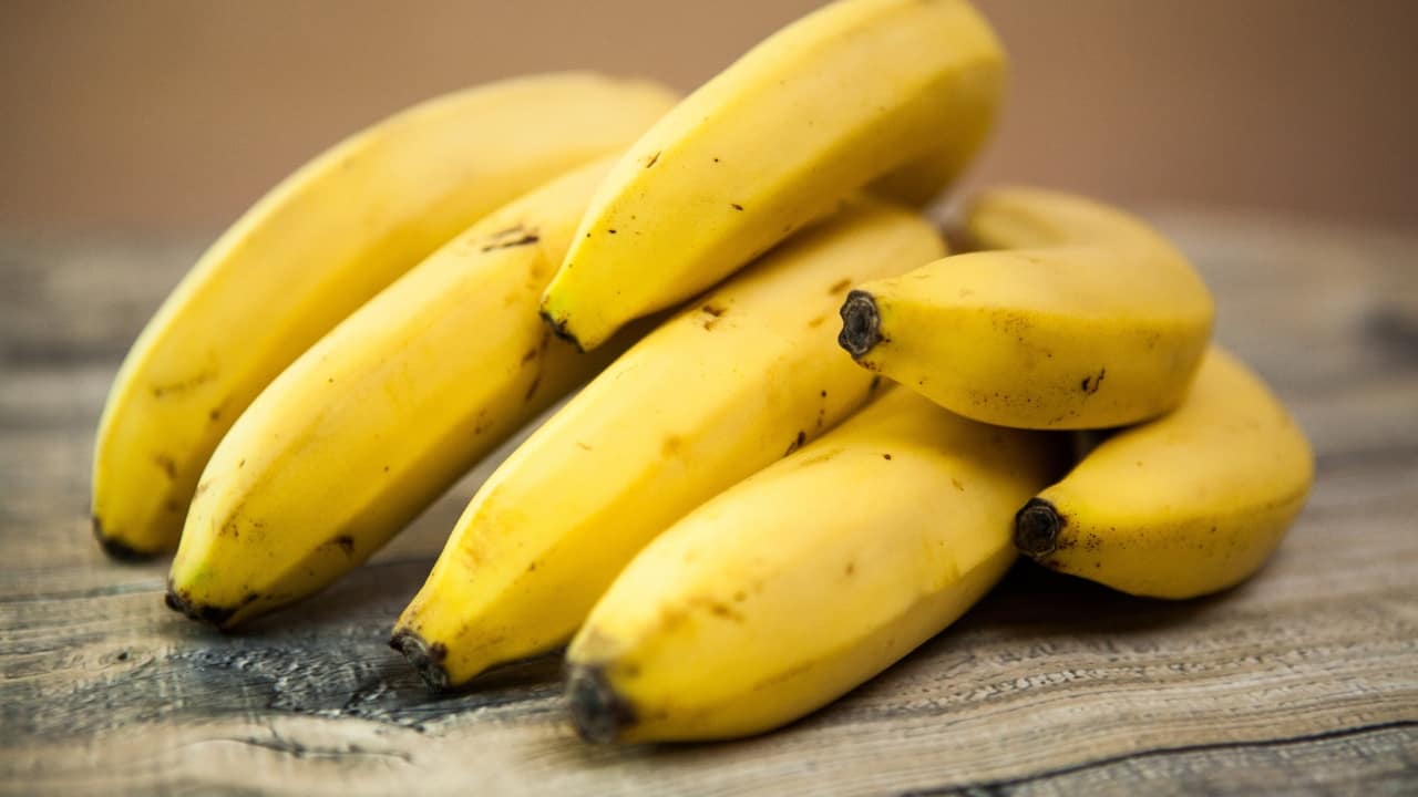 Bananas: Packed with potassium and magnesium, bananas relax muscles and nerves, promoting deeper and more restful sleep. They are also a good source of tryptophan, which the body converts into serotonin and melatonin, further supporting sleep regulation and quality. (Image: Canva)