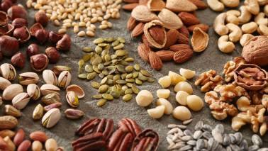 Nuts and Seeds: Almonds, walnuts, and flaxseeds are excellent sources of vitamin E and omega-3 fatty acids. Vitamin E is an antioxidant that protects the eyes from free radical damage, which can cause age-related issues like macular degeneration. Omega-3s contribute to the health of the eye's blood vessels and help reduce dry eyes and inflammation. (Image: Canva)