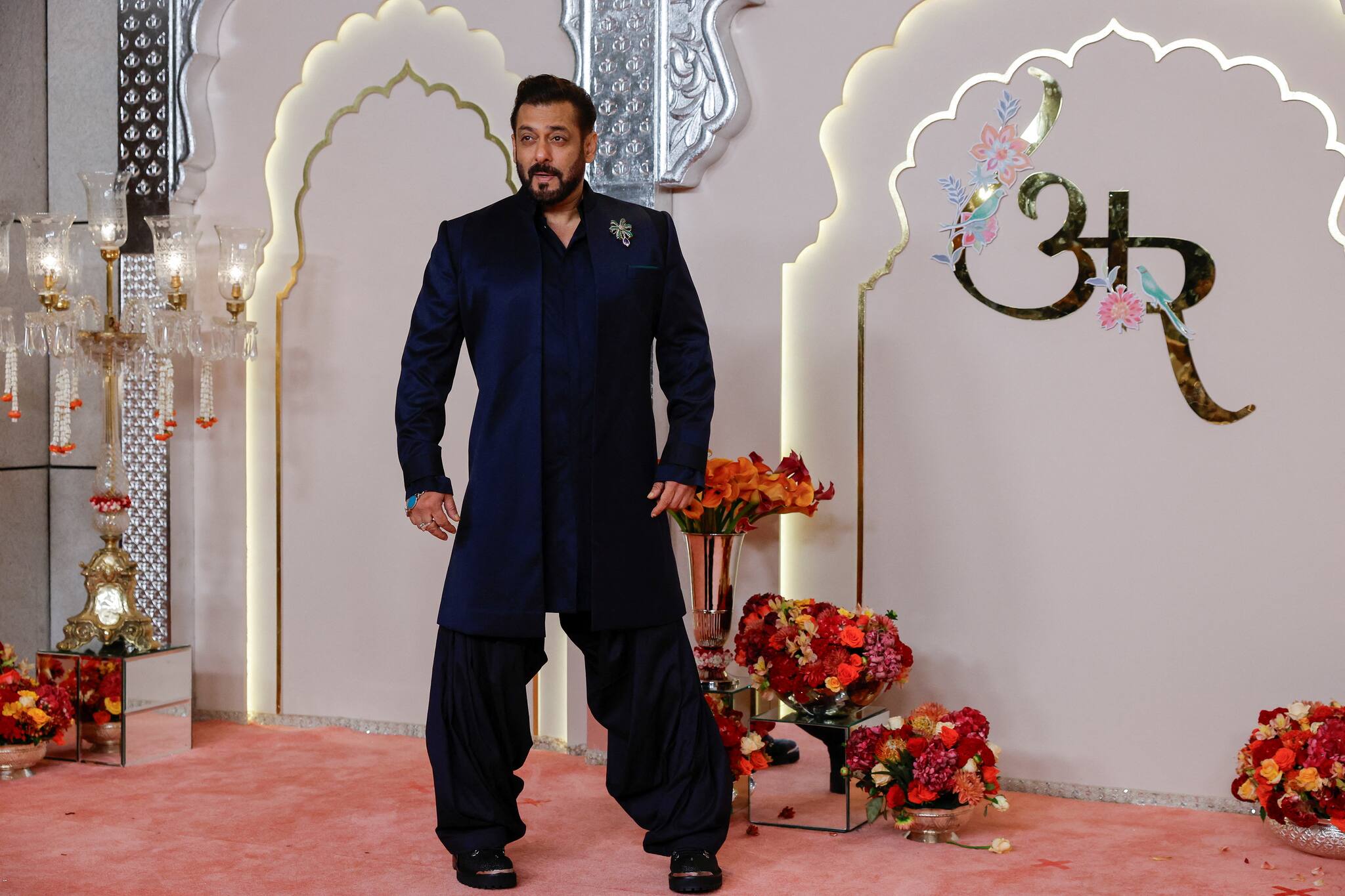Actor Salman Khan poses for pictures on the red carpet on the day of the wedding of Anant Ambani and Radhika Merchant in Mumbai, India, July 12, 2024. REUTERS/Francis Mascarenhas