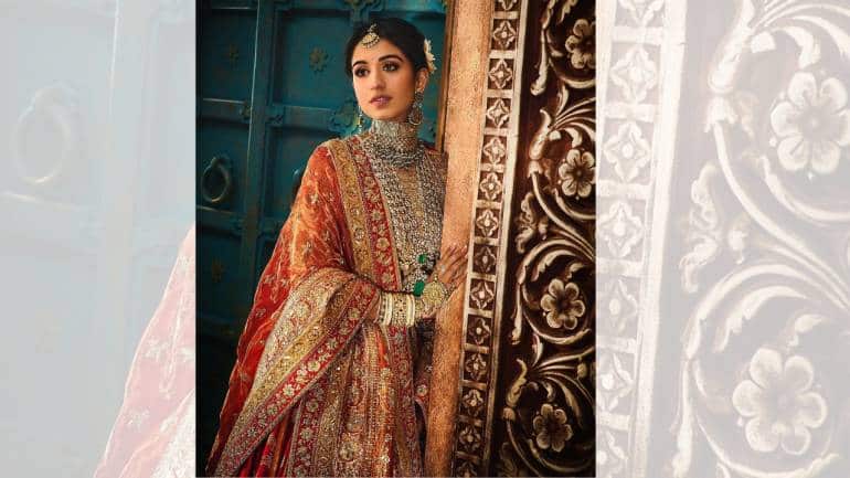 Draping her silhouette was a lattice-designed Banarasi dupatta, which enveloped the ensemble in the deep, regal legacy of India. The dupatta’s intricate design added a layer of sophistication and elegance, completing the look. For a special touch up, the bride adorned herself with family jewels in emerald and diamonds worn previously by her nani, mother, and sister at their weddings. These heirlooms added a personal and emotional touch to her bridal ensemble, symbolizing the continuity of tradition and the cherished memories of generations past (Image: @manishmalhotraworld, @manishmalhotravows/Instagram)