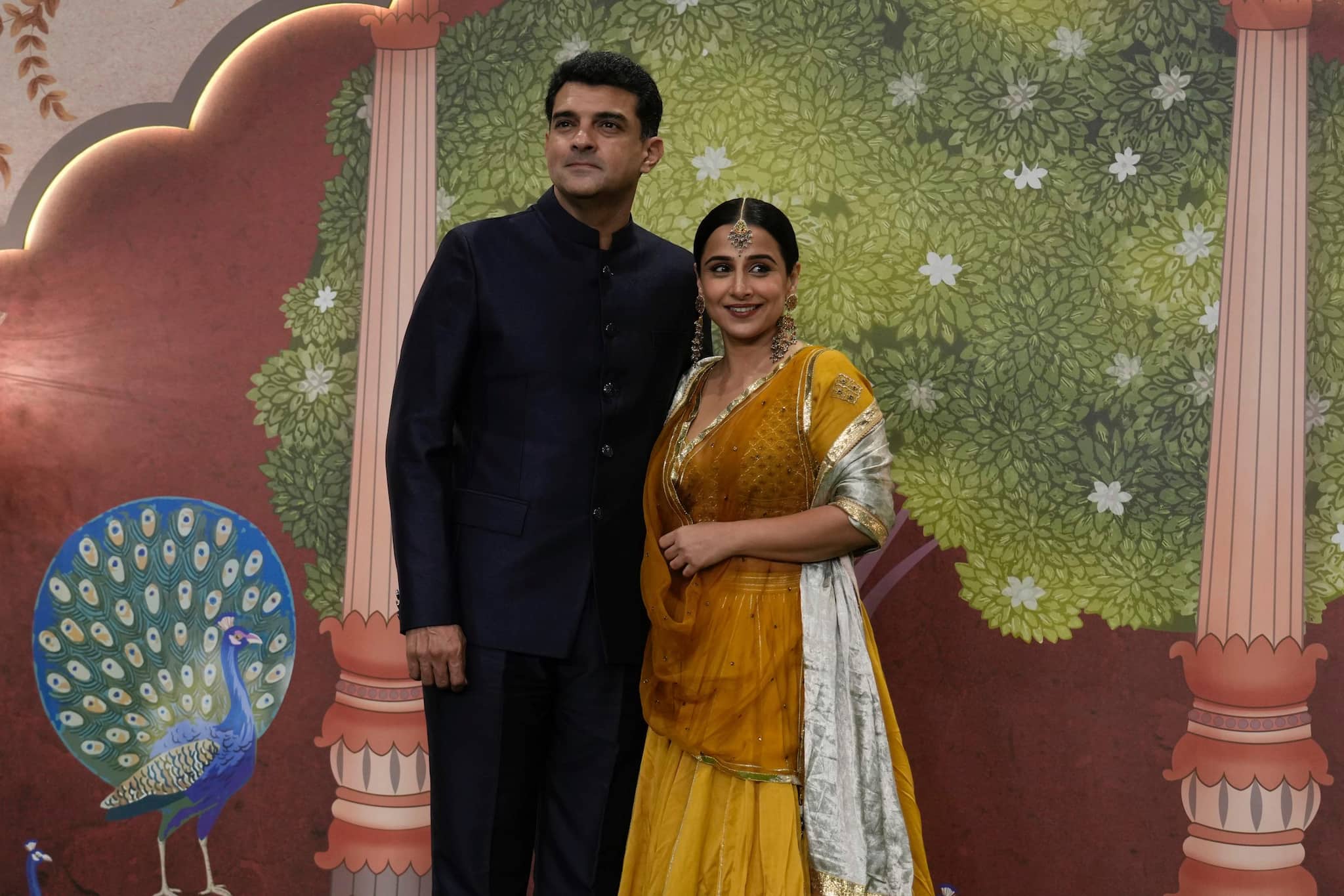 Bollywood actress Vidya Balan along with her husband Siddharth Roy Kapur pose for a picture during the blessing ceremony of newlywed couple Anant Ambani son of billionaire Mukesh Ambani's and his wife Radhika Merchant at Jio World Convention Centre in Mumbai, India, Saturday, July. 13, 2024. (AP Photo /Rajanish Kakade)