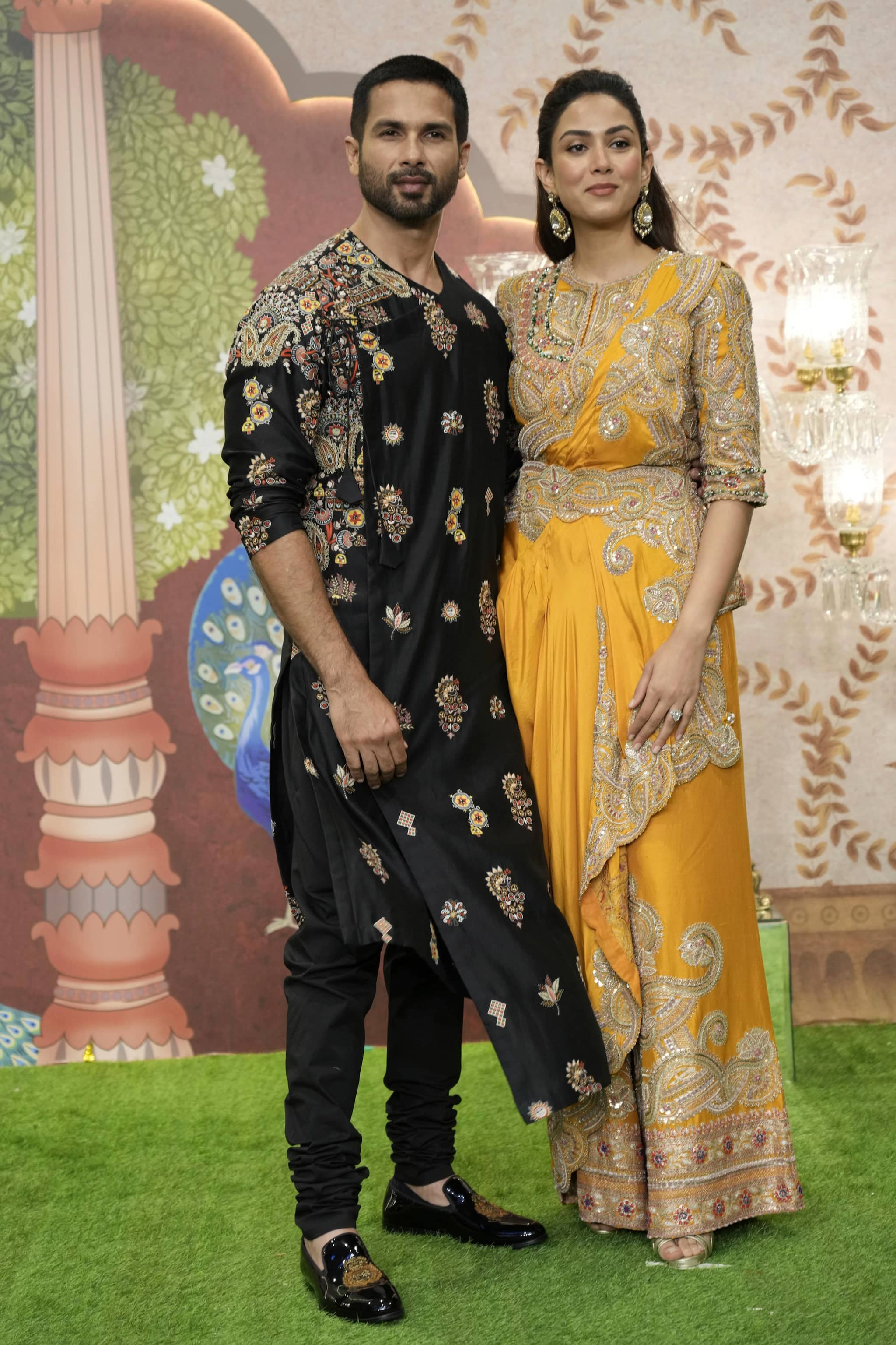 Indian actor Sahid Kapoor and his wife Mira Rajput pose for a picture during the blessing ceremony of newly wed couple Anant Ambani son of billionaire Mukesh Ambani's and his wife Radhika Merchant at Jio World Convention Centre in Mumbai, India, Saturday, July 13, 2024.(AP Photo /Rajanish Kakade)