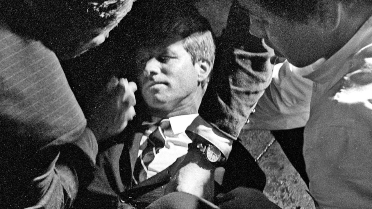 In this June 5, 1968 file photo, Hotel busboy Juan Romero, right, comes to the aid of Senator Robert F. Kennedy, as he lies on the floor of the Ambassador hotel in Los Angeles moments after he was shot.