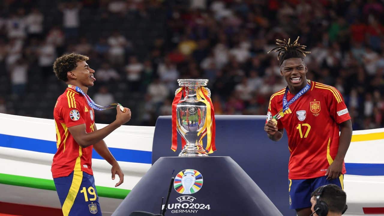 Soccer: Sublime Spain strike late to win record fourth Euro crown