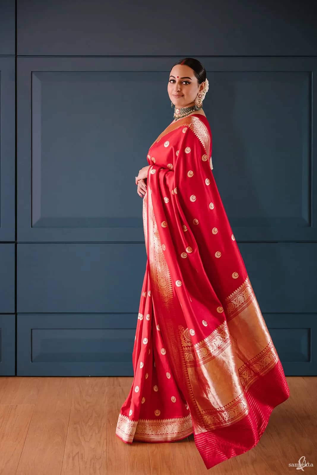 chose a bright red Raw Mango Banarasi silk brocade sari, which cost a more modest Rs 80,000.