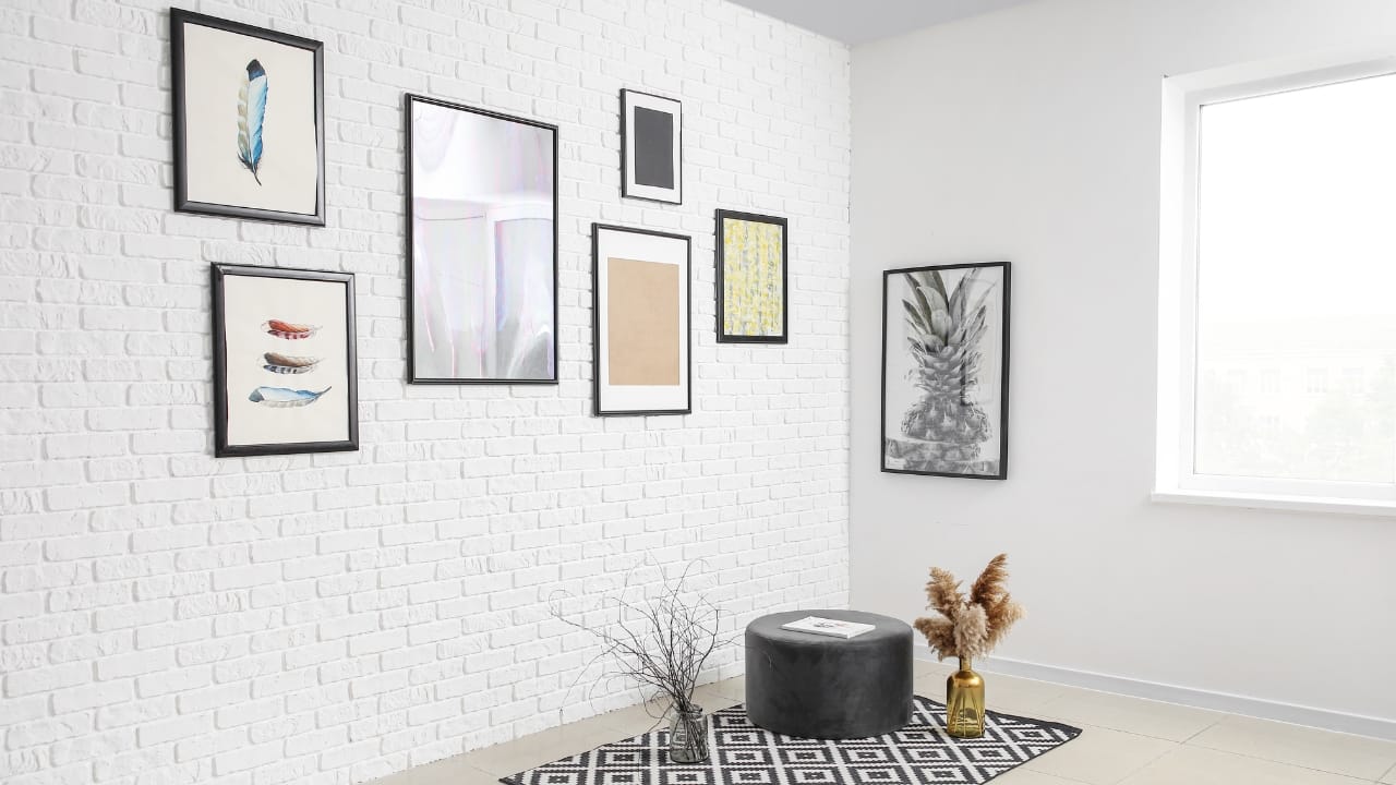 Gallery: Create a gallery wall with a mix of framed prints, photos, and artwork. This allows you to showcase a variety of styles and sizes, adding depth and interest to your space. You can use matching frames for a cohesive look or mix different styles for a more eclectic feel (Image: Canva