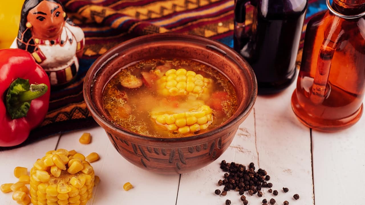 Corn soup with pepper: Start by sautéing onion and garlic in butter. Add corn kernels, baby corn, and 4 cups of water, and simmer for about 10 minutes until the corn is tender. Blend until smooth, then stir in a couple of tablespoons of corn powder to thicken the soup. Add finely cut baby corn for texture, and finish with a generous amount of black pepper for added flavour and a slight kick (Image: Canva)