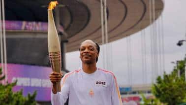 Paris Olympics 2024 opening ceremony: Snoop Dogg holding the Olympic torch 