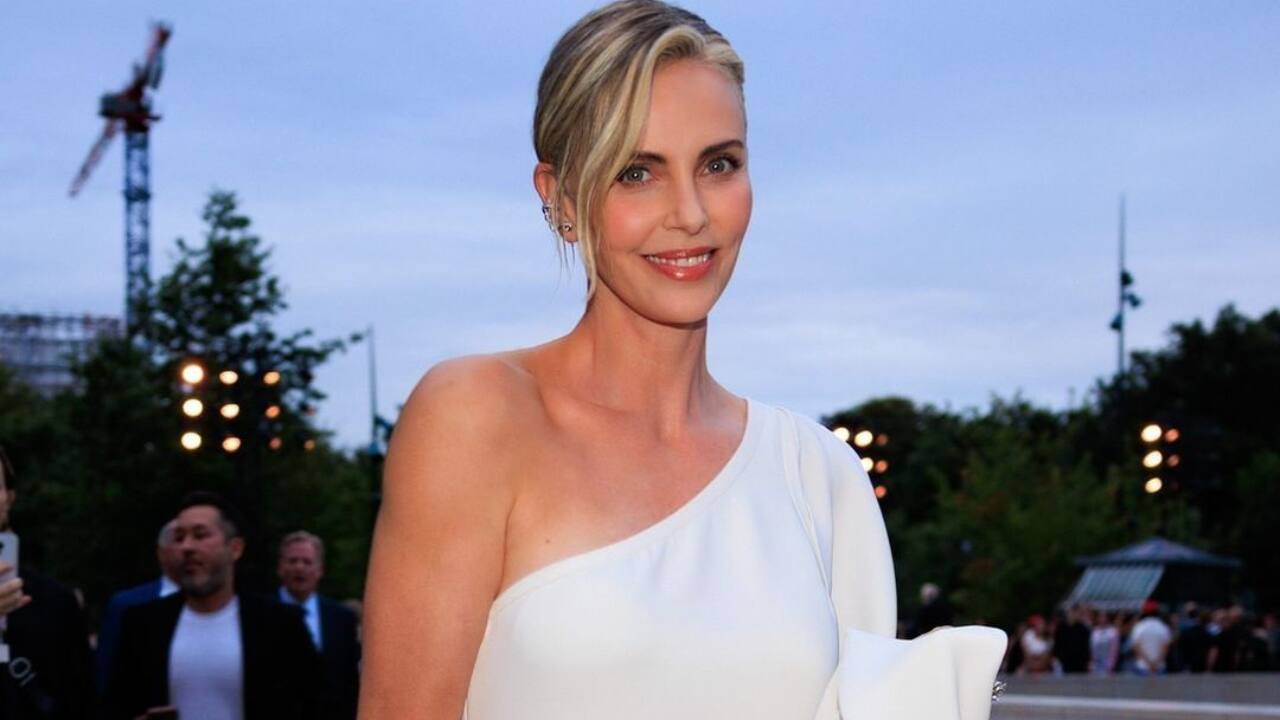  Charlize Theron, Ashlyn Harris, and Sophia Bush Charlize Theron wore elegant evening formals, while Ashlyn Harris and Sophia Bush also impressed with their sophisticated looks.Each of them showcased fashion that was perfect for the prestigious event.