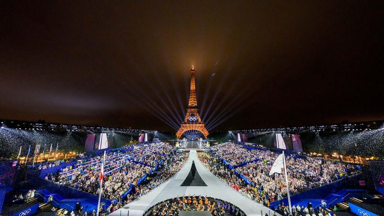  Overview of the Trocadero venue, with the Eiffel Tower looming in the background while the Olympic flag is being raised