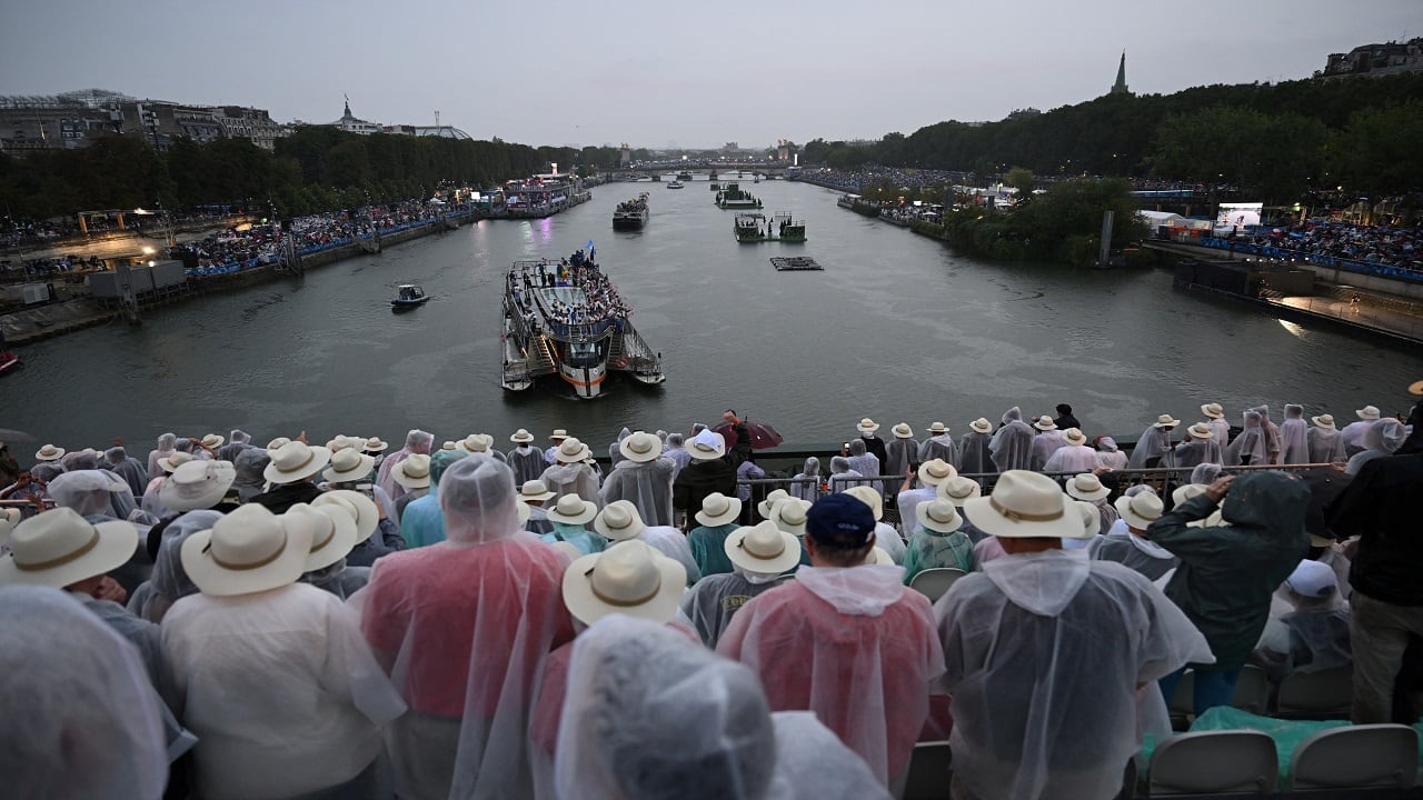 Boats carrying members of delegations sail along the Seine during the opening ceremony of Paris Olympics 2024