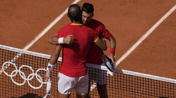 Novak Djokovic shares a hug with Rafael Nadal at Paris Olympics