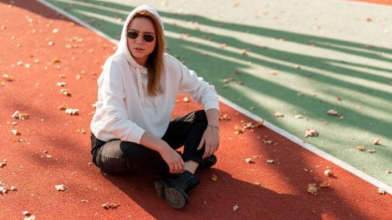 How to style streetwear: Enhance your streetwear by pairing casual pieces with tailored items. For a sophisticated twist, try a streetwear hoodie with a sharp blazer or joggers with a tailored coat (Image: Canva)