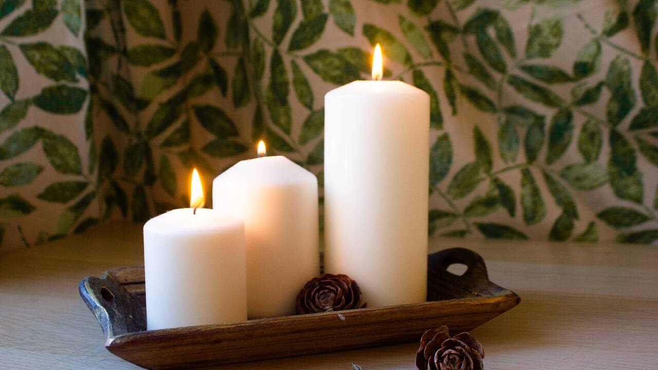 Pillar candles: Pillar candles are thick, sturdy candles that can stand on their own without the need for a holder. They come in various heights and diameters, making them versatile for different decorative purposes. Pillar candles are ideal for creating a dramatic centrepiece on a dining table or adding height to a candle arrangement. They burn for a long time and can be used in both indoor and outdoor settings (Image: Canva)
