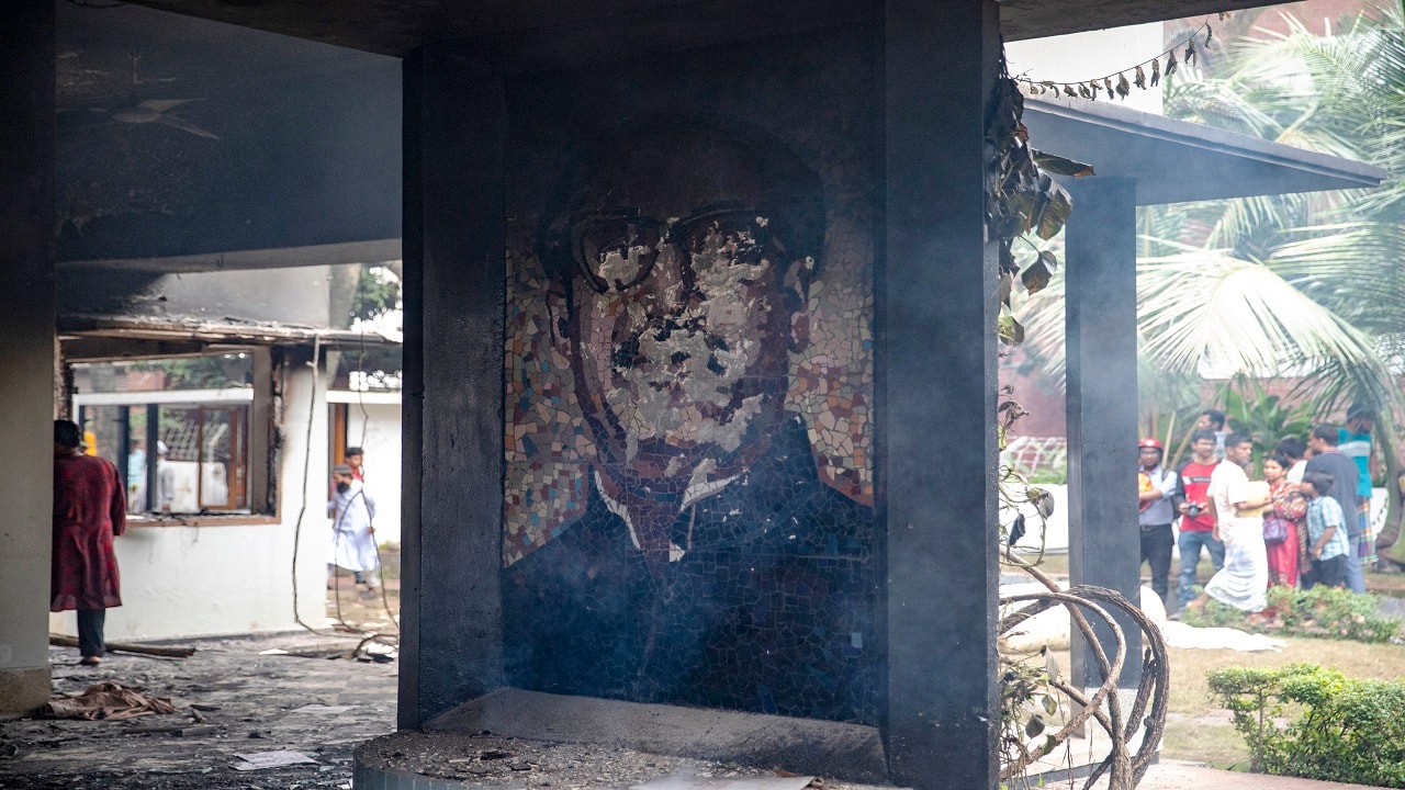A portrait of Sheikh Mujibur Rahman, the founding father of Bangladesh and father of the ousted Prime Minister Sheikh Hasina, lies damaged at the Bangabandhu Memorial Museum, which was set ablaze by anti-government protesters in Dhaka on August 6. In response to the unrest, Bangladesh's President Mohammed Shahabuddin has ordered the release of those detained during the protests, including former Prime Minister Khaleda Zia. A portrait of Sheikh Mujibur Rahman, the founding father of Bangladesh and father of the ousted Prime Minister Sheikh Hasina, lies damaged at the Bangabandhu Memorial Museum, which was set ablaze by anti-government protesters in Dhaka on August 6. In response to the unrest, Bangladesh's President Mohammed Shahabuddin has ordered the release of those detained during the protests, including former Prime Minister Khaleda Zia.