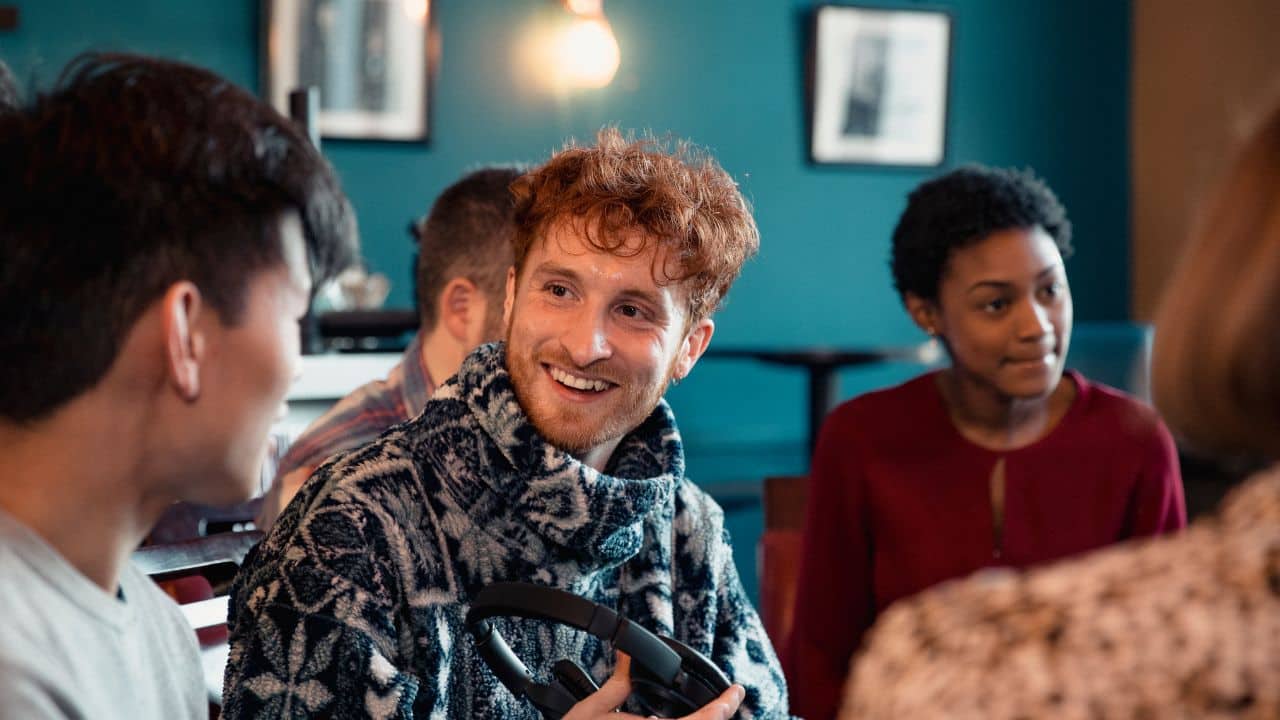 Socialise and engage in meaningful conversations: Engaging with others in stimulating discussions can challenge your thinking and expand your knowledge. (Image: Canva)