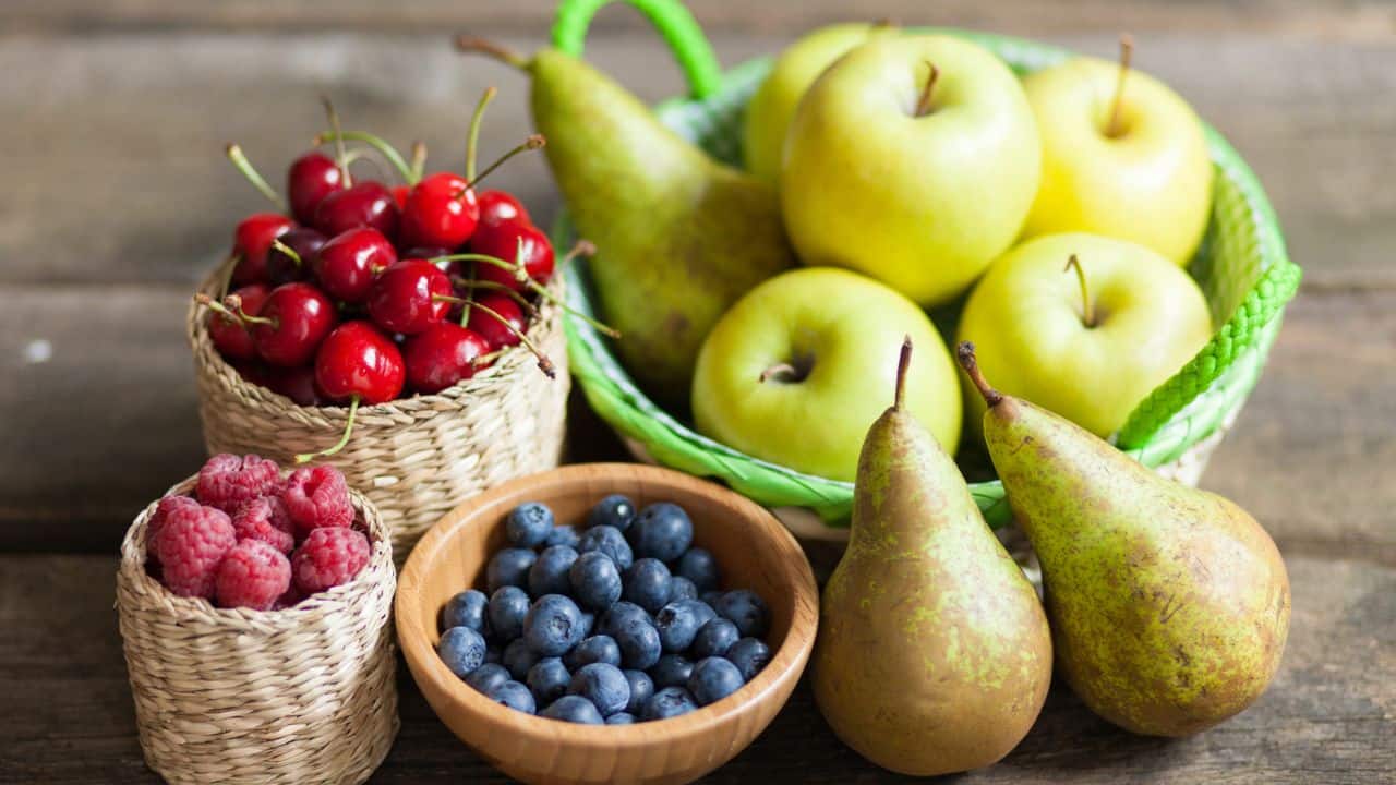 Increase fibre intake: Fibre slows down the absorption of sugar and improves blood sugar control. It also helps with digestion and weight management. Foods high in fibre include fruits like apples and berries, vegetables such as broccoli and carrots, whole grains like oats and brown rice, and legumes. (Image: Canva)