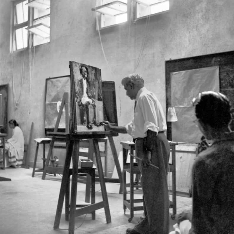 N.S. Bendre in the 1940s was creating a kind of Indian figuration that borrowed from the traditions but turned them into something modern, explains Singh. He adds that this influenced many Indian artists, including Gaitonde, Jeram Patel in his early figurations, and J. Sultan Ali in his early figurations. N.S. Bendre went on to establish the faculty of fine arts in Baroda. 'If you look at his early works, Bendre creates a kind of elongated, stylized Indian figure in a modern rendition and that rendition then finds an echo in the work of abstractionists like Jeram Patel or J. Sultan Ali... this was a kind of response to what the colonial art schools were teaching,' Singh says. (Image: N.S. Bendre in Baroda, Gujarat, in 1957; photo by Jyoti Bhatt via X/India Lens)