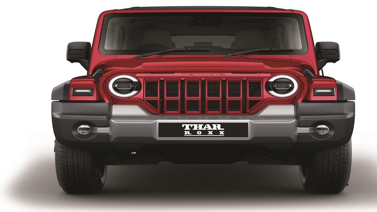 The design features a bold front grille paired with Bi-LED projector headlamps and Cshaped DRLs, ensuring superior visibility in all conditions. Its classic silhouette, characterised by a long hood, upright cabin, and short overhangs for exceptional approach and departure angles, upholds the iconic Thar design. The design features a bold front grille paired with Bi-LED projector headlamps and Cshaped DRLs, ensuring superior visibility in all conditions. Its classic silhouette, characterised by a long hood, upright cabin, and short overhangs for exceptional approach and departure angles, upholds the iconic Thar design.