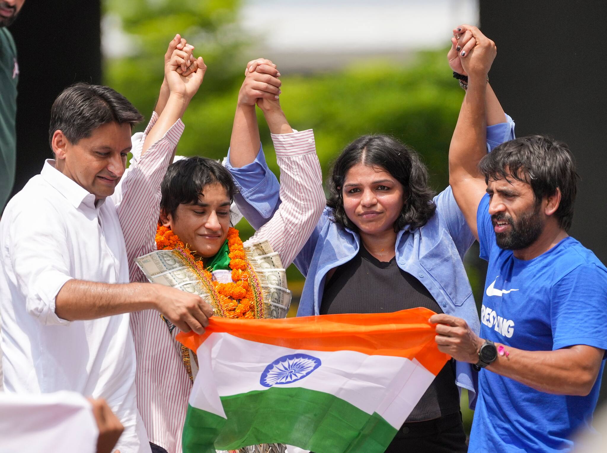 Vinesh was received by wrestlers Bajrang Punia, Sakshi Malik. (PTI Photo)