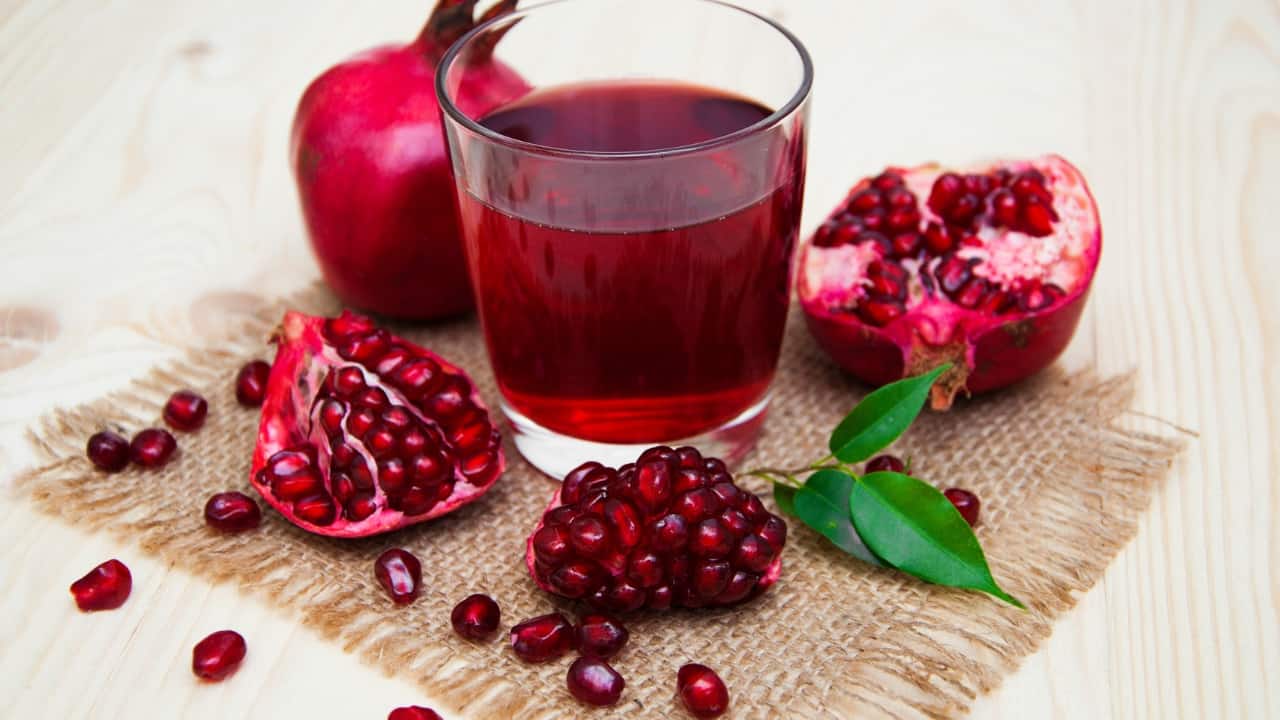Pomegranate Juice: Pomegranate is rich in iron and vitamins that support blood health. Drink fresh pomegranate juice daily to help boost platelet levels. (Image: Canva)