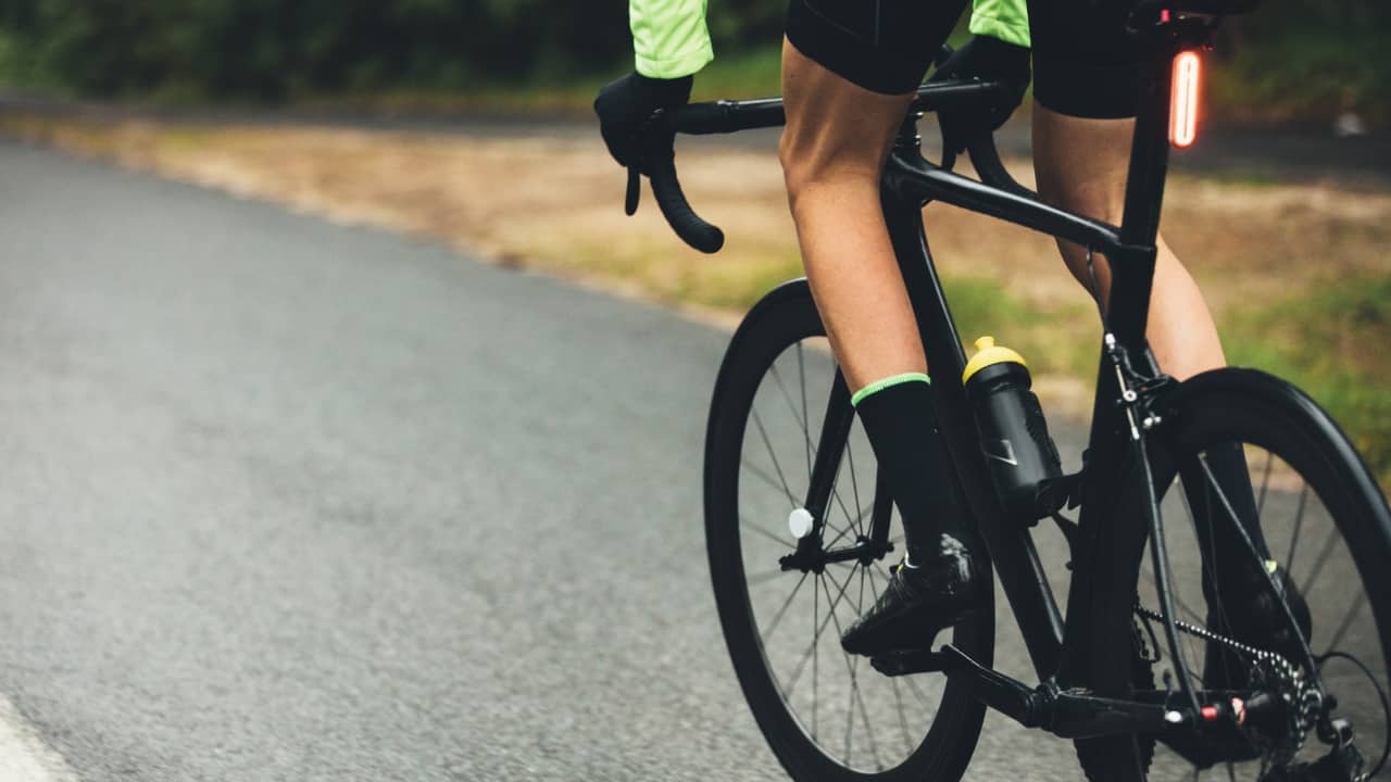 Cycling: Cycling, whether on a stationary bike or outdoors, provides an excellent cardiovascular workout that strengthens leg muscles while being kind to the joints. Start with moderate cycling sessions and gradually increase speed and resistance to enhance fat burning. (Image: Canva)