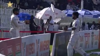 Mohammad Rizwan tosses bat towards Babar Azam