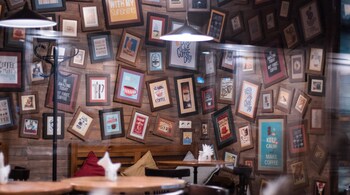 A well-designed gallery wall serves as a striking focal point, adding character and visual interest to any space. (Image: Canva)