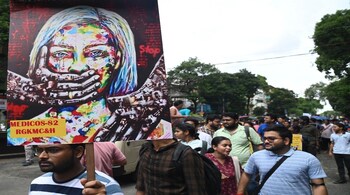 Junior doctors take part in a protest rally against the alleged sexual assault and murder of a postgraduate trainee doctor at R G Kar Medical College and Hospital, in Kolkata, on Aug 28, 2024. (PTI Photo)
