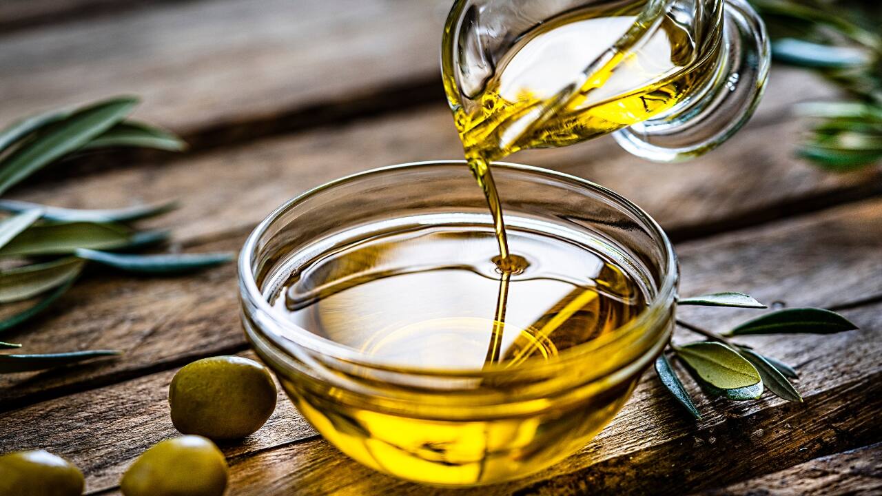 Benefits of olive oil: Olive oil is also known for its ability to improve scalp health and prevent dandruff, contributing to hair health (Image: Canva)