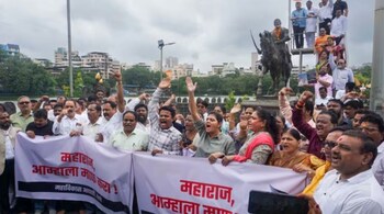 Members of Maha Vikas Agadhi (MVA) protest against the collapse of Malvan's Shivaji Maharaj statue, in Thane.