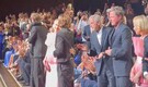 George Clooney and Brad Pitt share a heartfelt hug at Wolfs world premiere