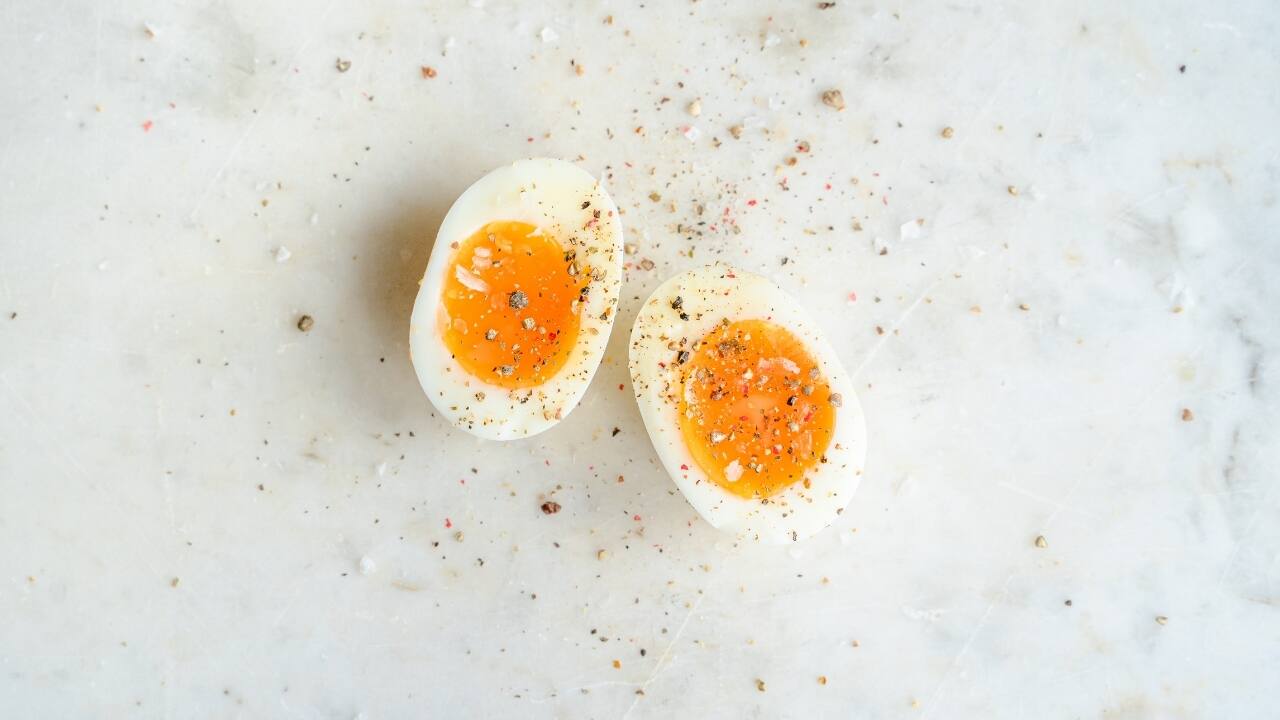 Eggs: Eggs, especially the yolks, are high in healthy fats, protein, and essential nutrients like choline, which supports brain function. Enjoy eggs boiled, poached, scrambled, or as an omelet. Pair with whole-grain toast or veggies for a balanced meal. (Image: Canva)