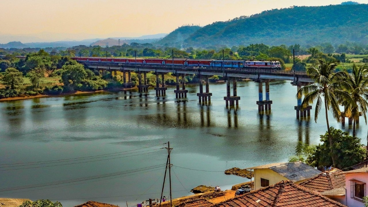 Feast your eyes on the mesmerizing sight of a train gliding gracefully across the sparkling Savitri River near Sape-Wamane station in Maharashtra. (Image: X/@RailMinIndia)